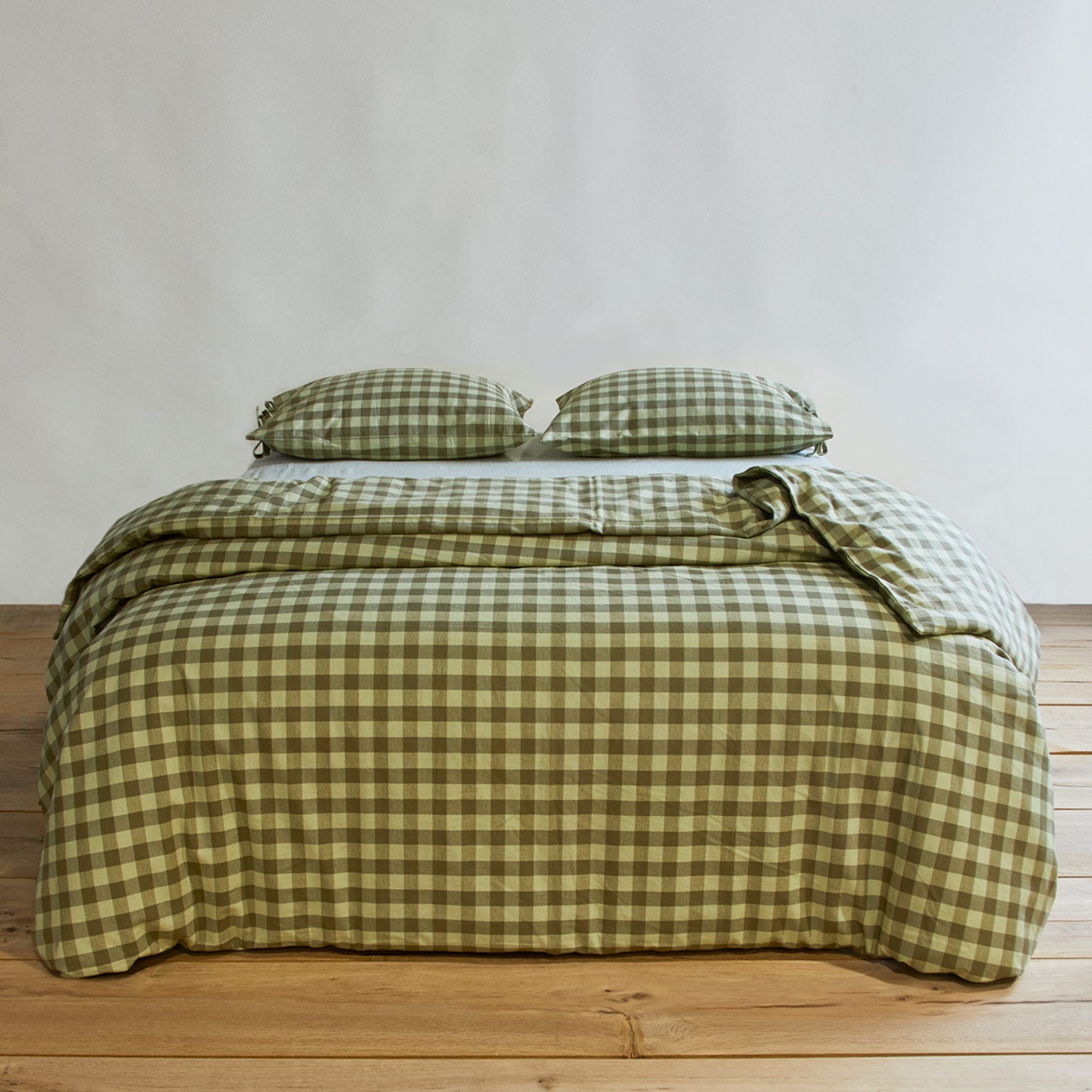 Essential Gingham Pillowcases, Set of 2 - Sage/Olive on bed with matching duvet cover.