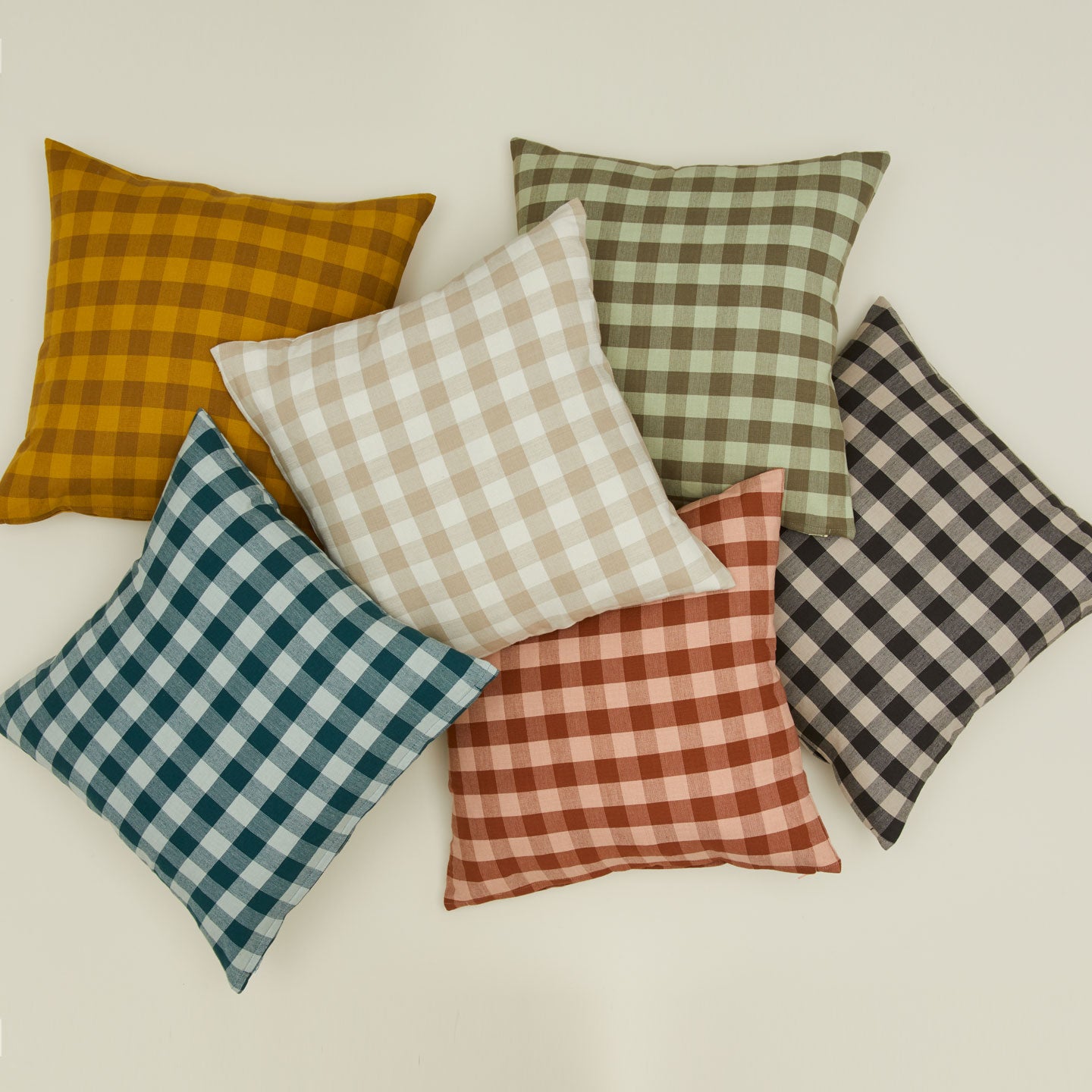 Gingham square pillows in various colors