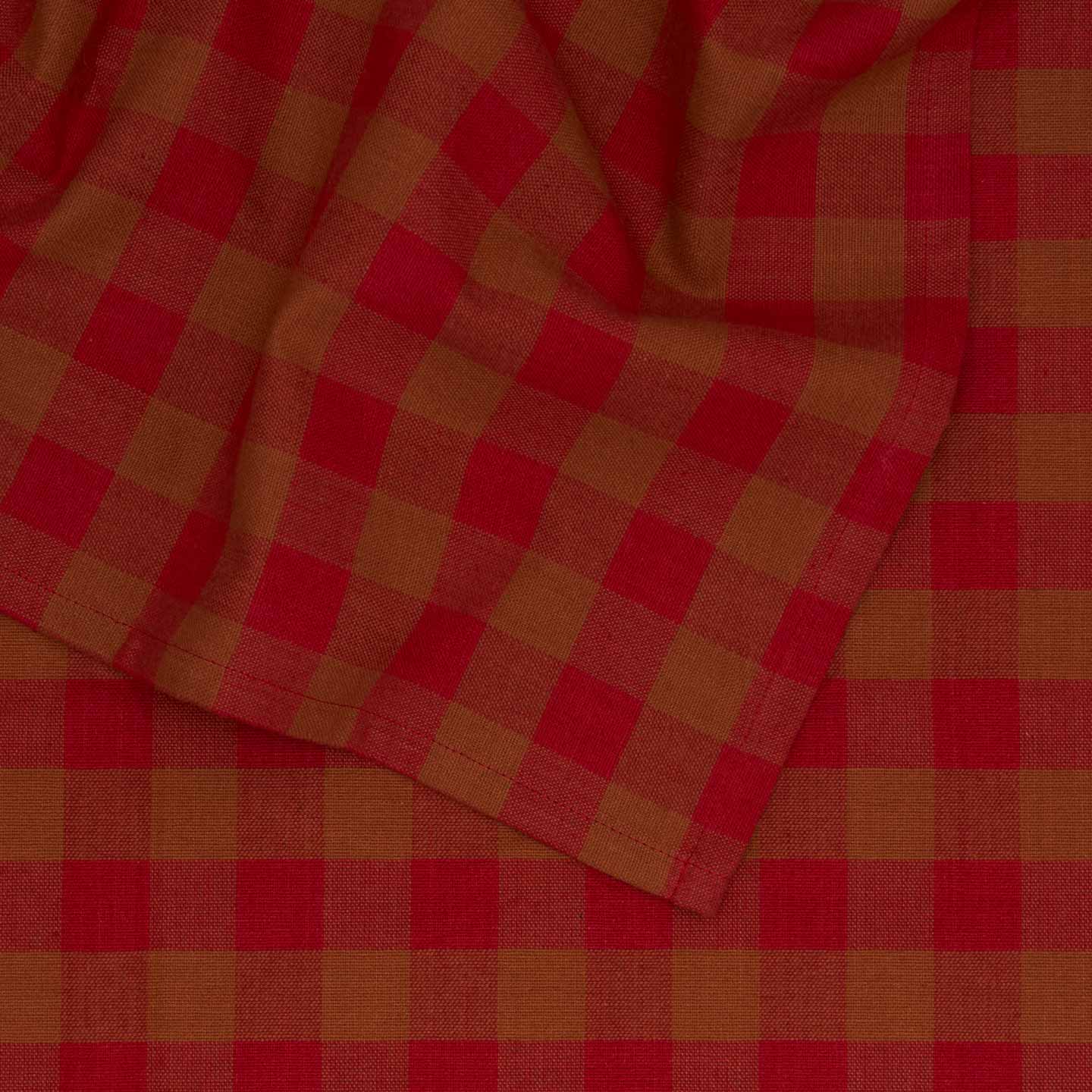 Close up view of Essential Gingham tablecloth in red/terracotta