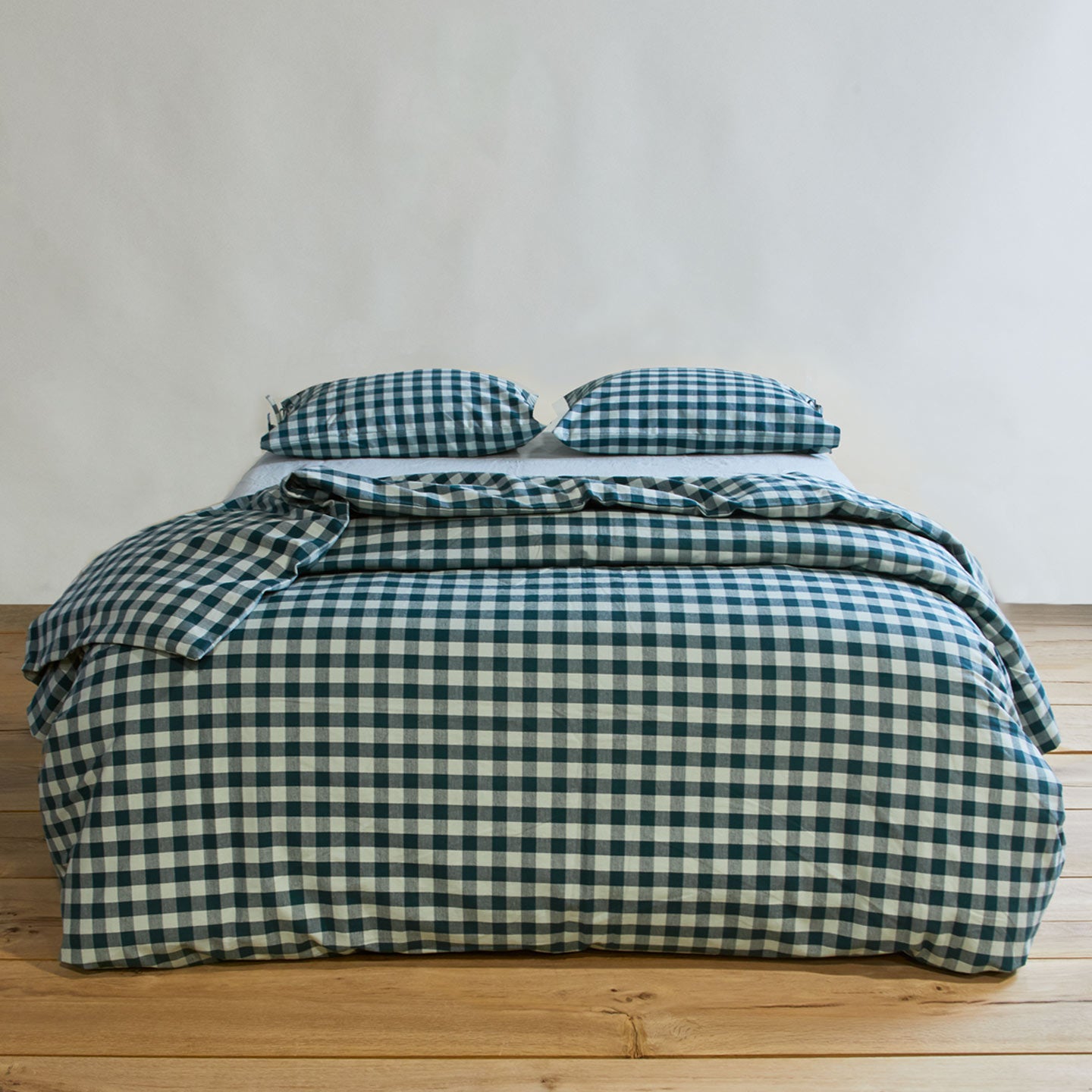 Essential Gingham Pillowcases, Set of 2 - Sky/Peacock on bed with matching duvet