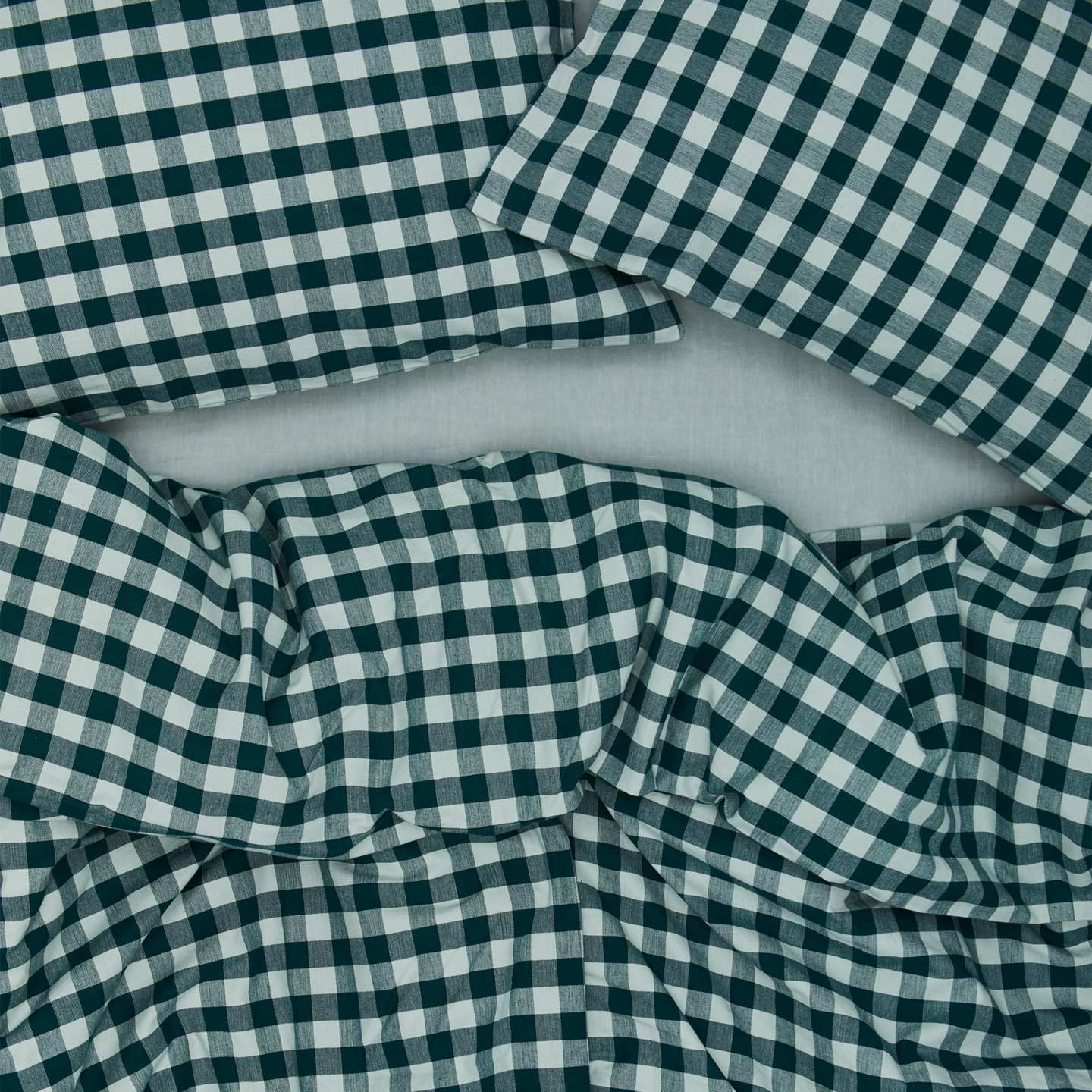 Essential Gingham Pillowcases, Set of 2 - Sky/Peacock on bed with matching duvet cover