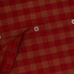 Close up view of essential gingham duvet cover in terracotta/red