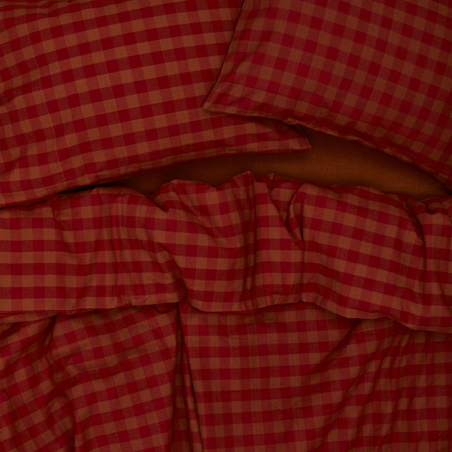 Essential Gingham Pillowcases, Set of 2 - Terracotta/Red on bed with matching duvet cover