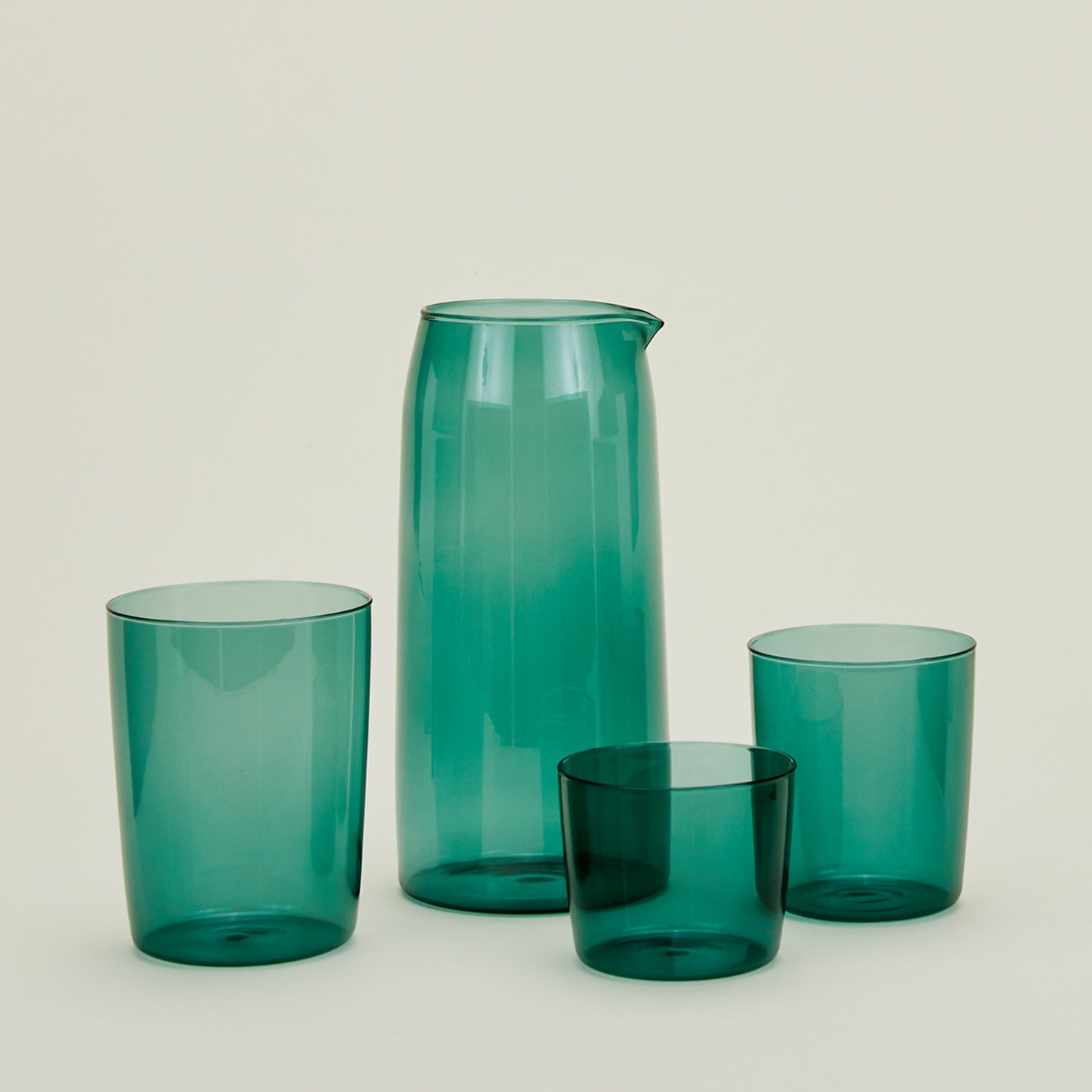Small, Medium and Large Essential Glasses with Essential Glassware Pitcher in Peacock.
