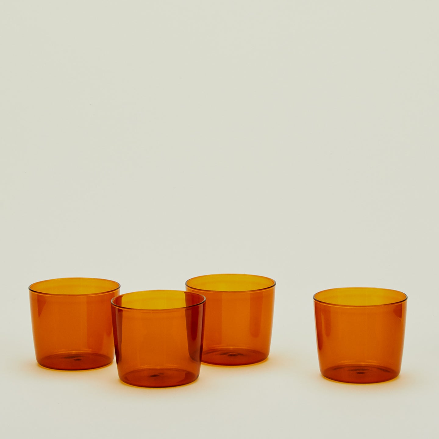 Four Small Essential Glasses in Terracotta.