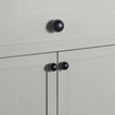 Large and small black essential sphere knobs on drawers and cabinets