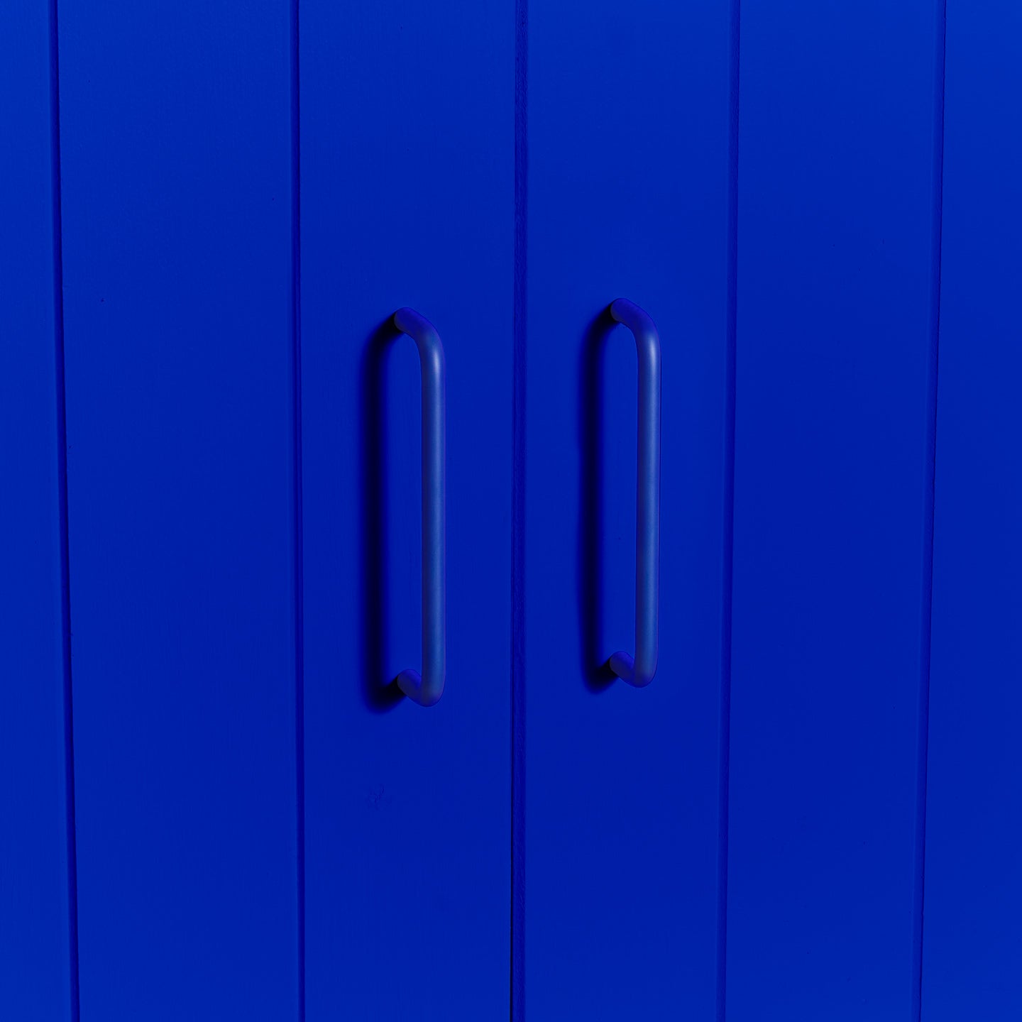 Large essential drawer pull in klein blue on cabinet