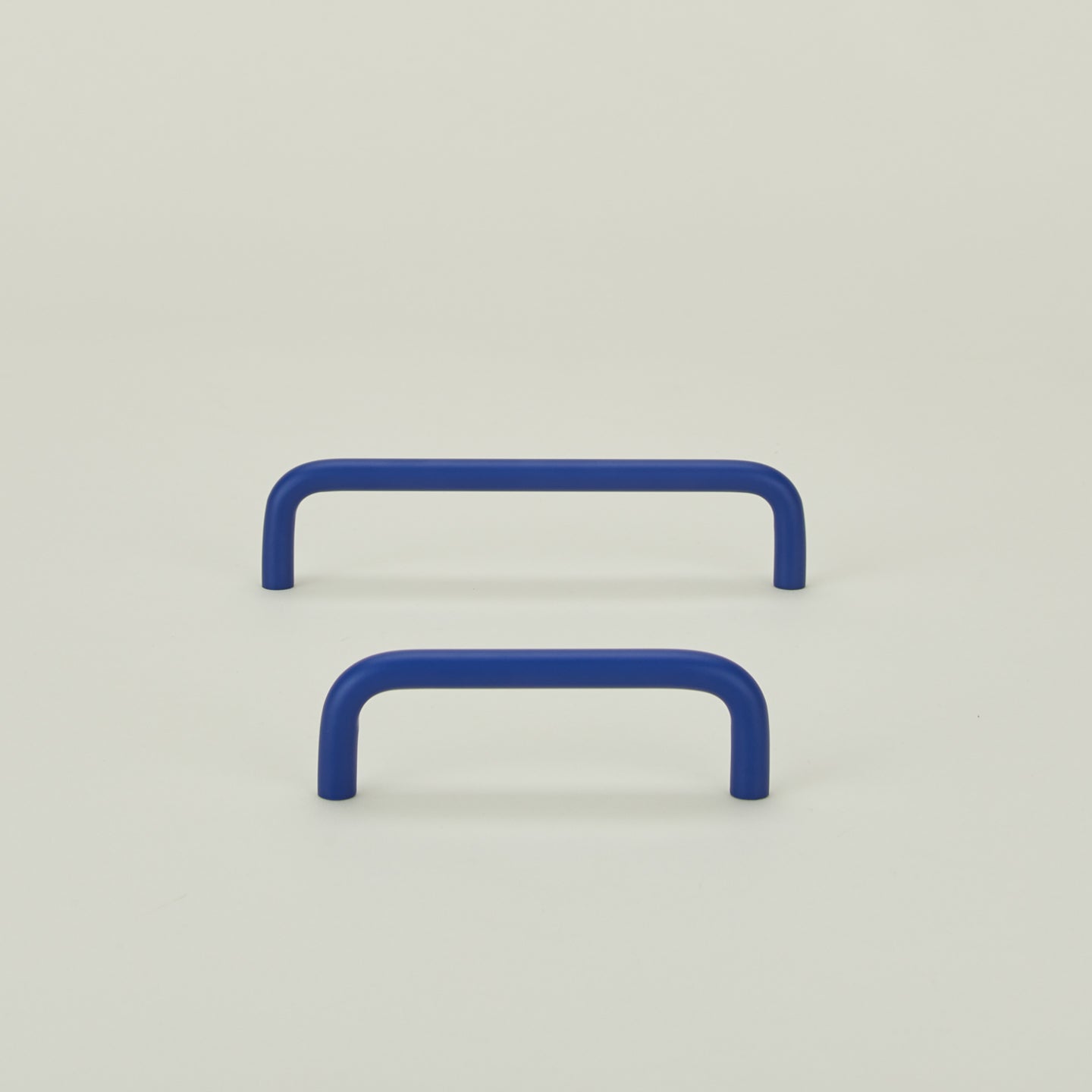 Large and small essential drawer pulls in klein blue
