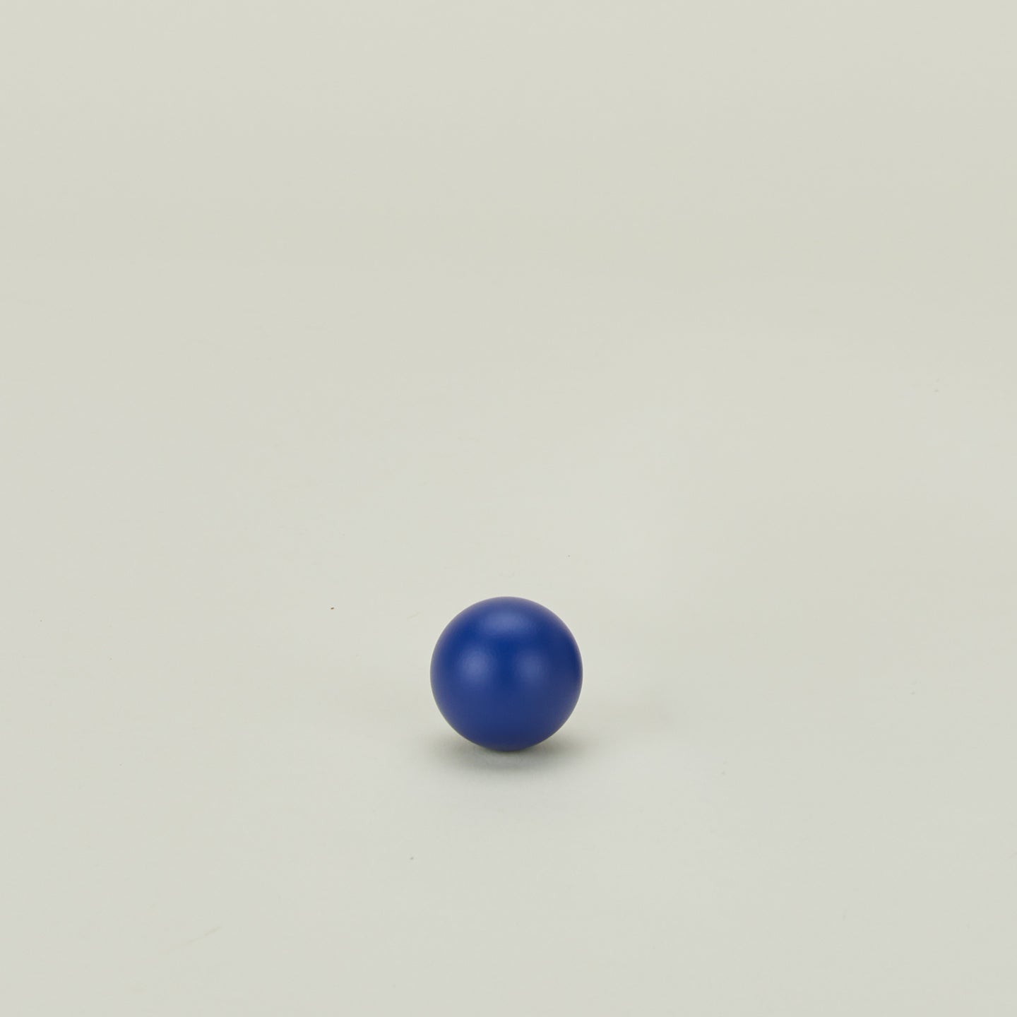 Small essential sphere knob in klein blue