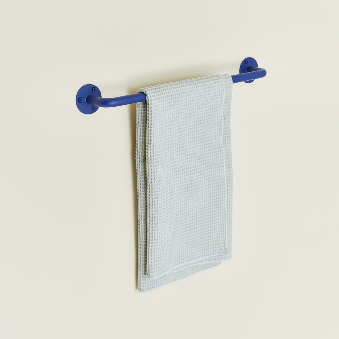 Essential towel bar holder in klein blue with towel