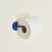 Essential toilet paper holder in klein blue with toilet paper roll