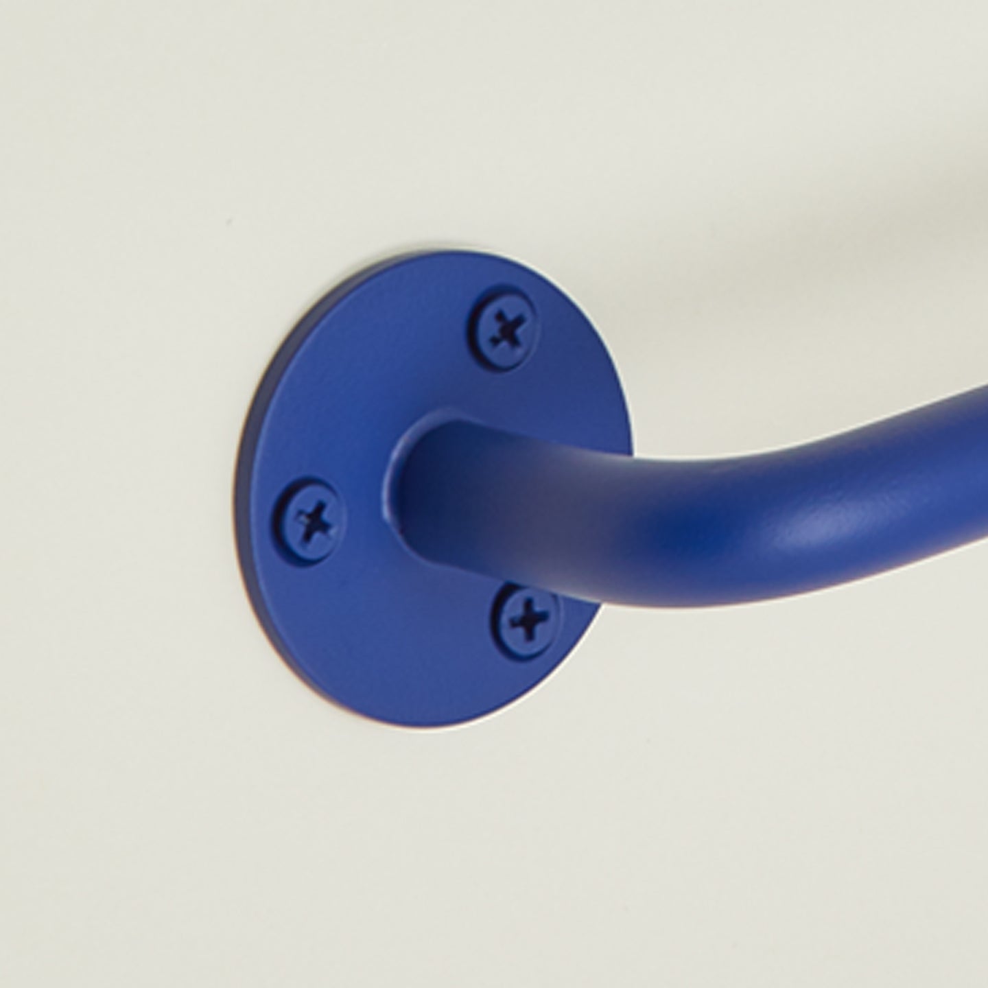 Close up view of essential towel bar in klein blue