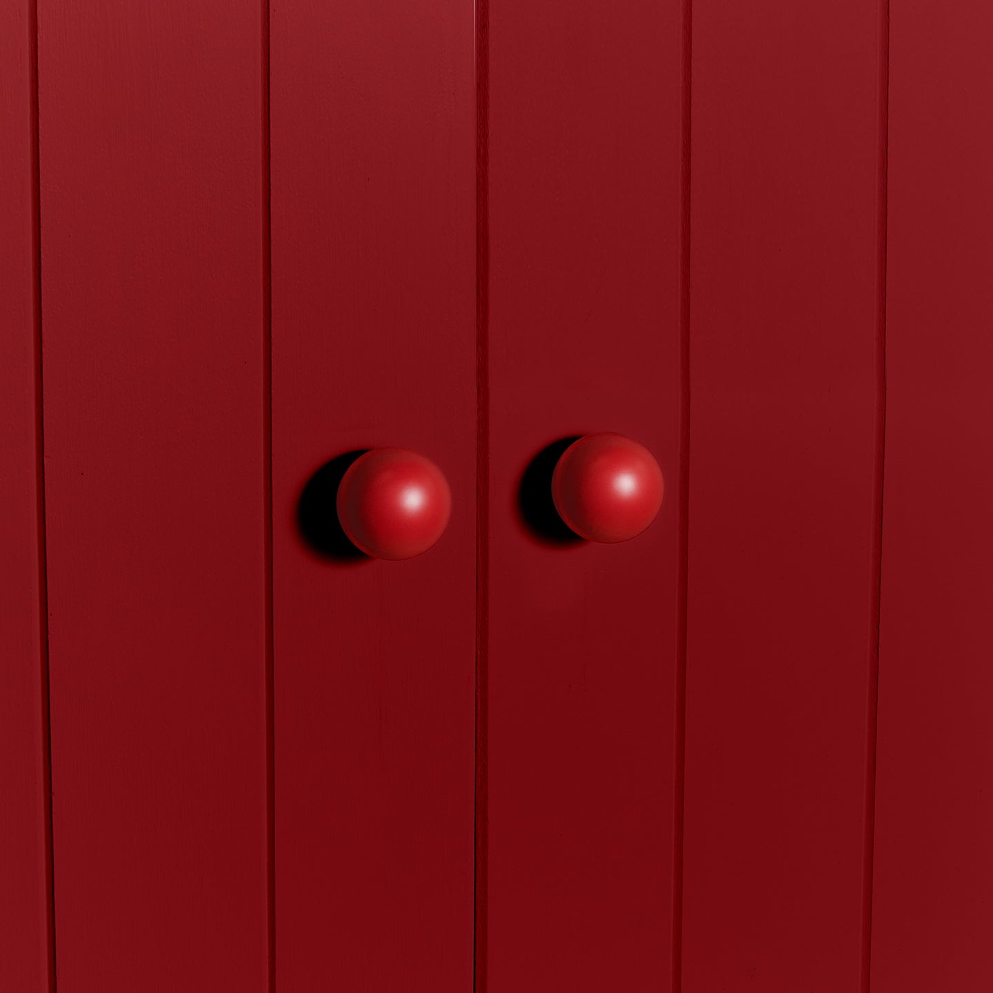 Large sphere knob in red on cabinet