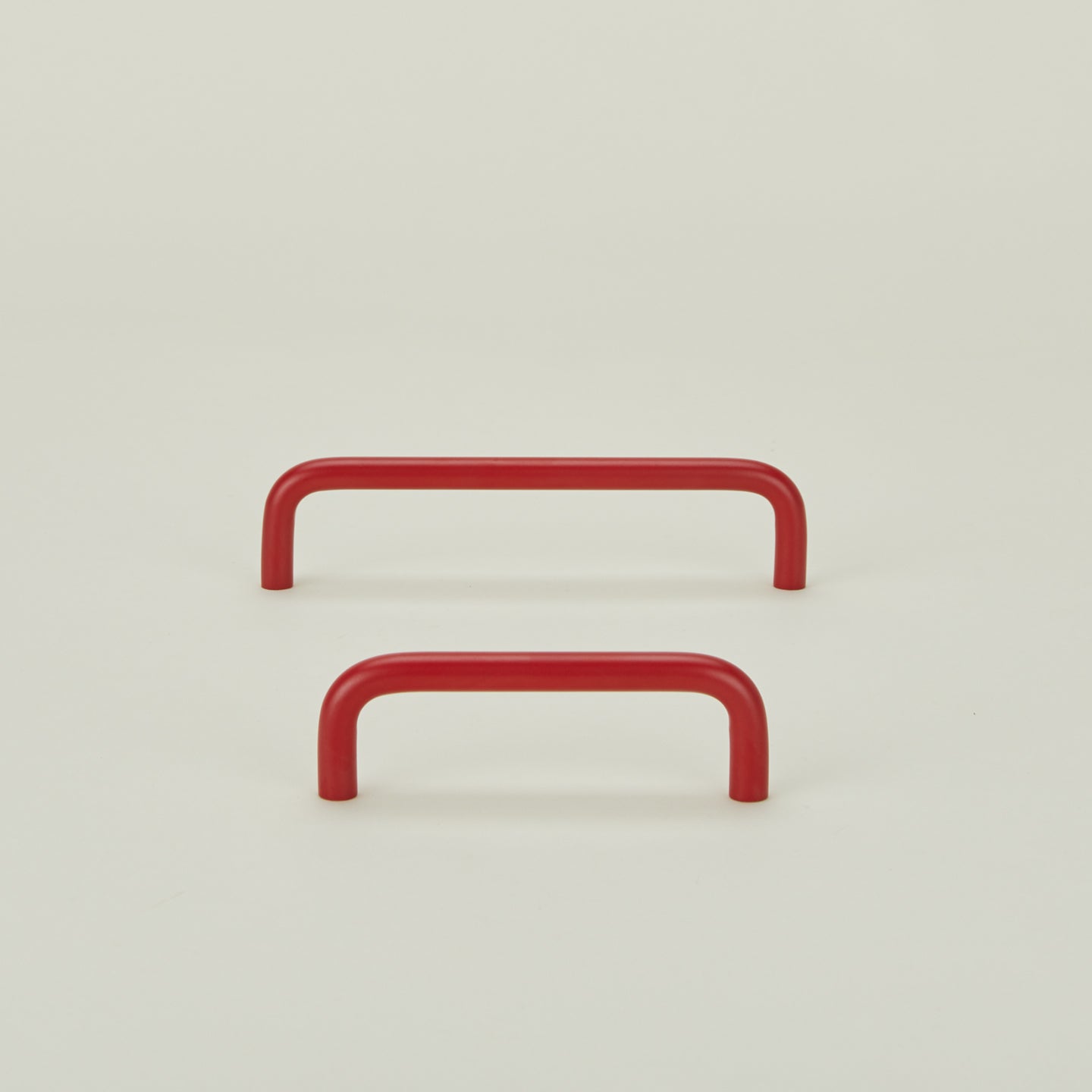 Large and small essential drawer pulls in red