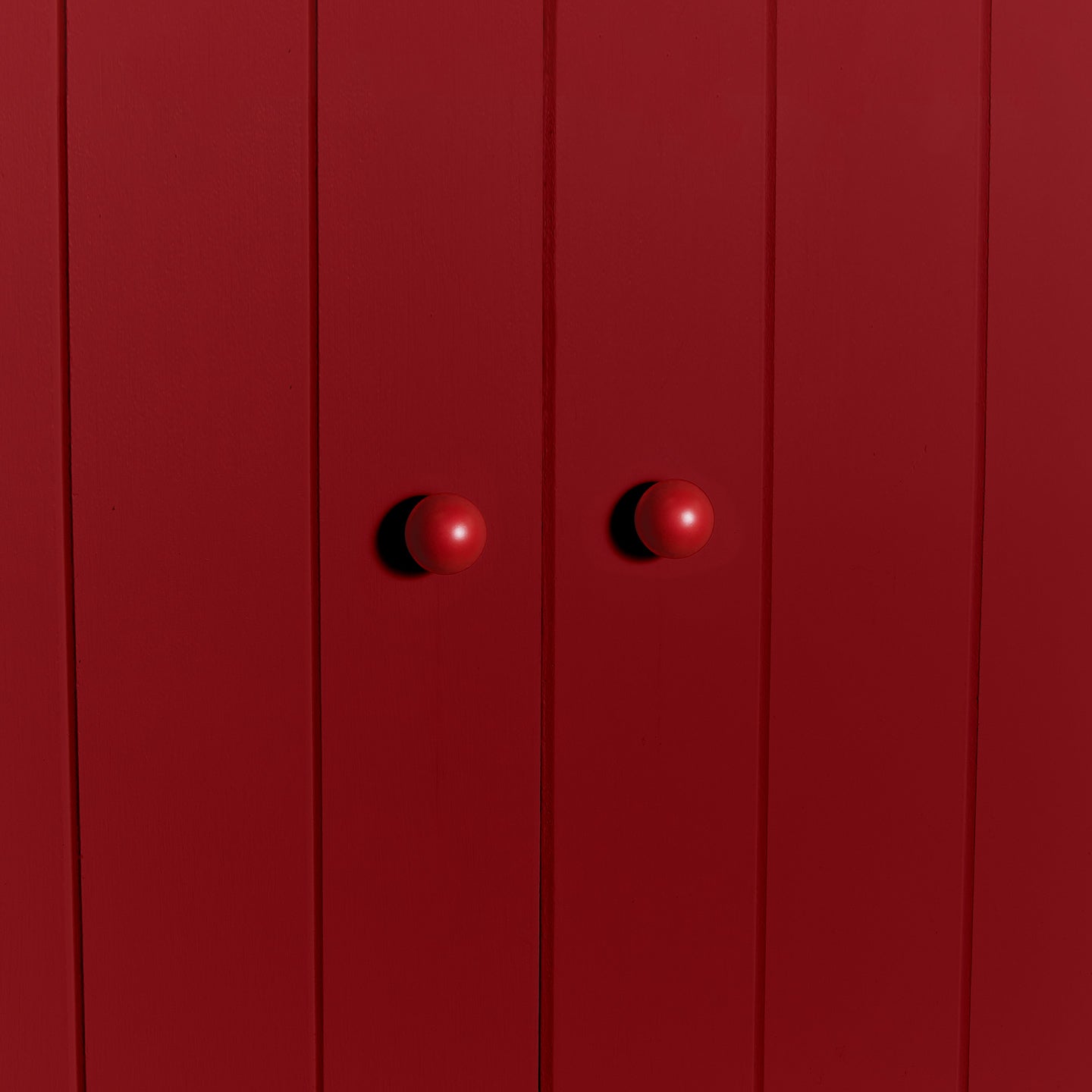 Small sphere knobs in red on cabinet