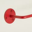 Close up view of essential toilet paper holder in red