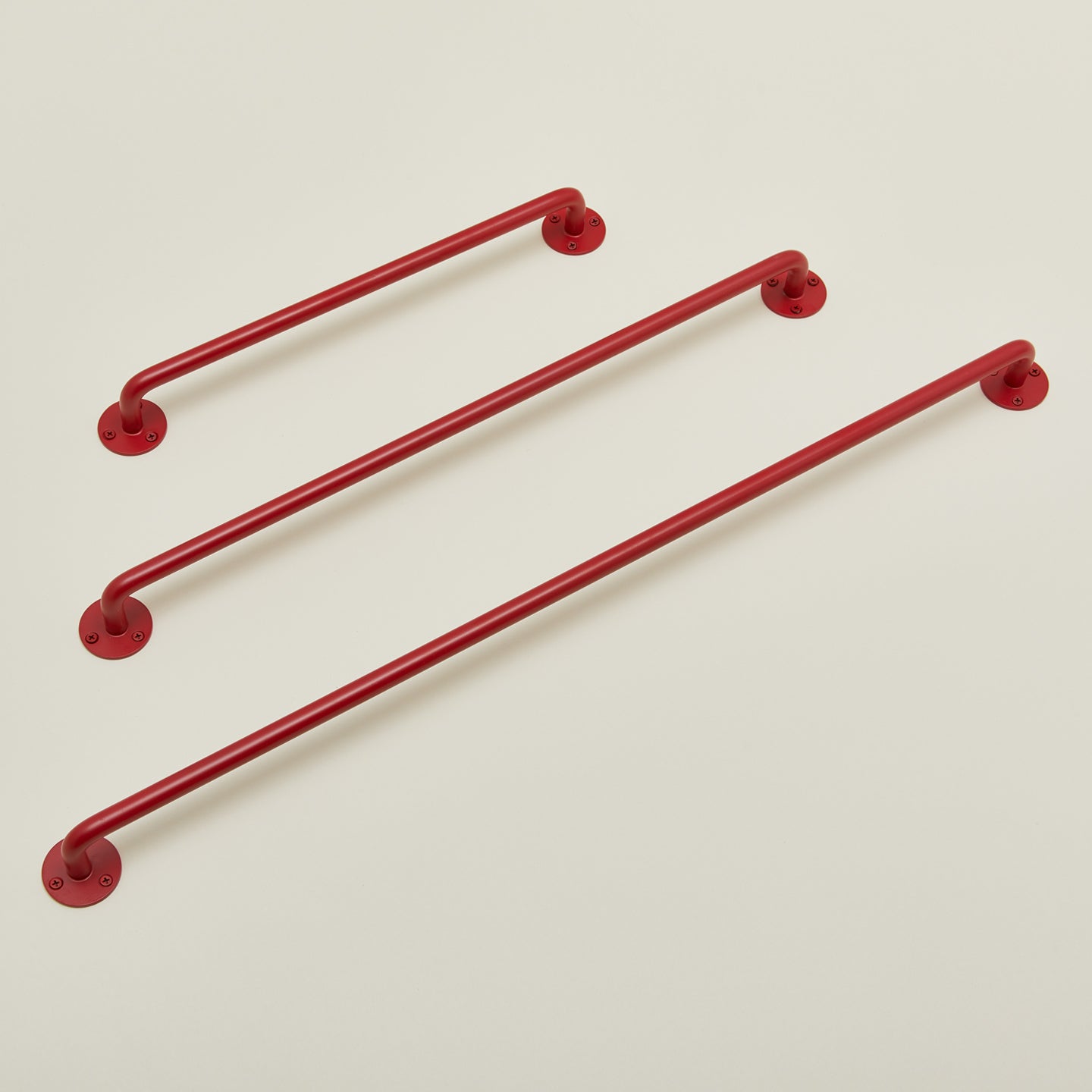 Essential towel bars in red in various sizes