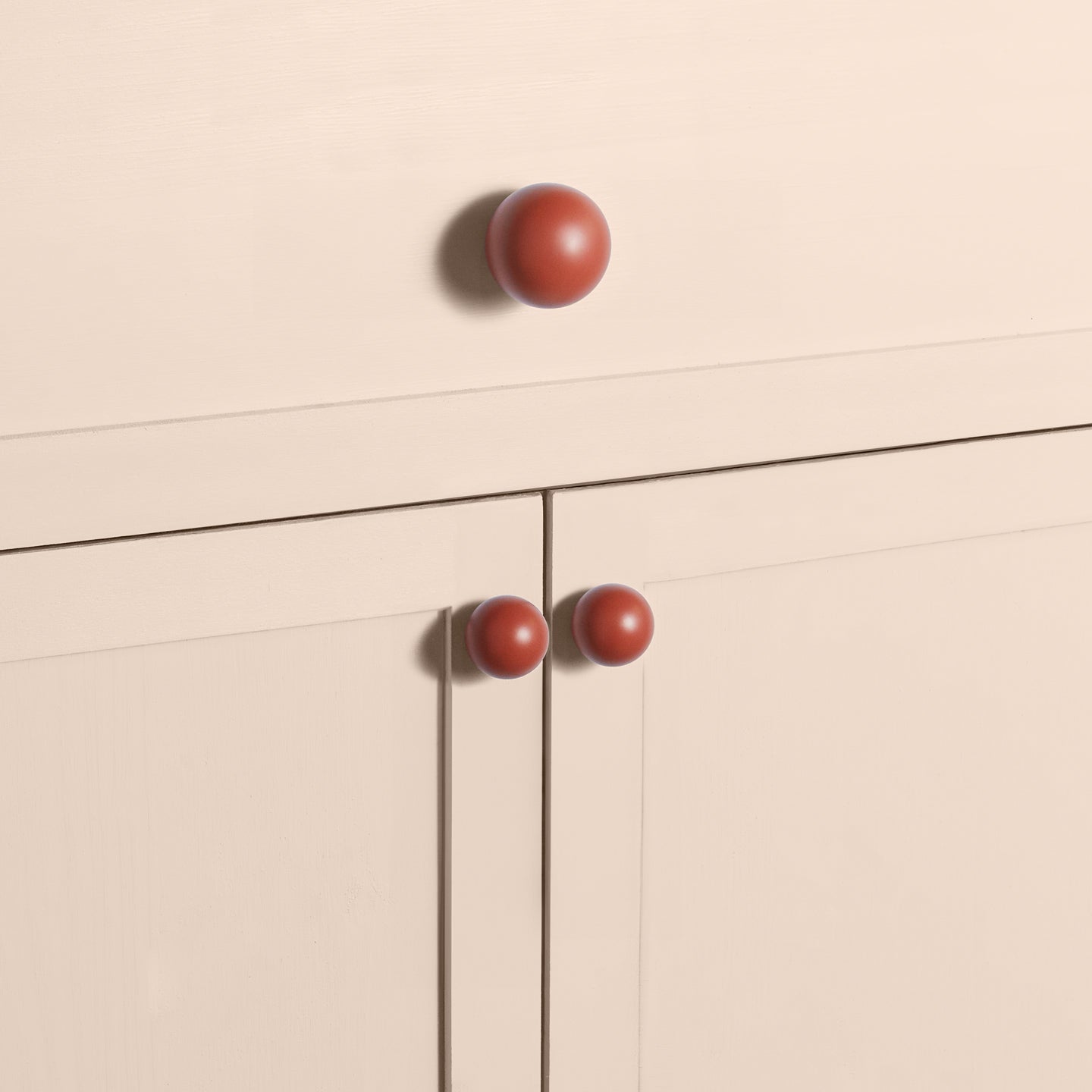 Large and small terracotta essential sphere knobs on drawers and cabinets
