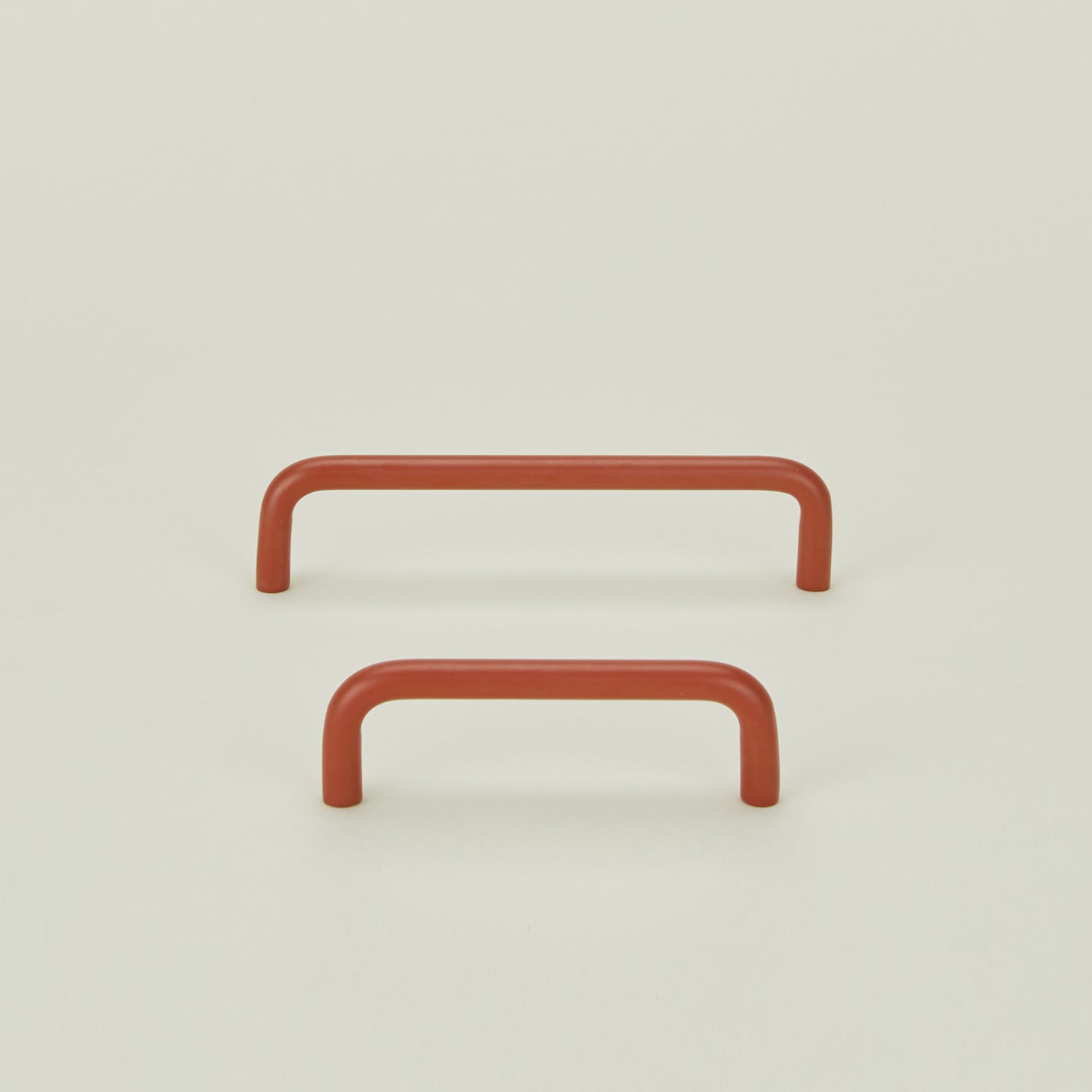 Small and large drawer pulls in Terracotta.