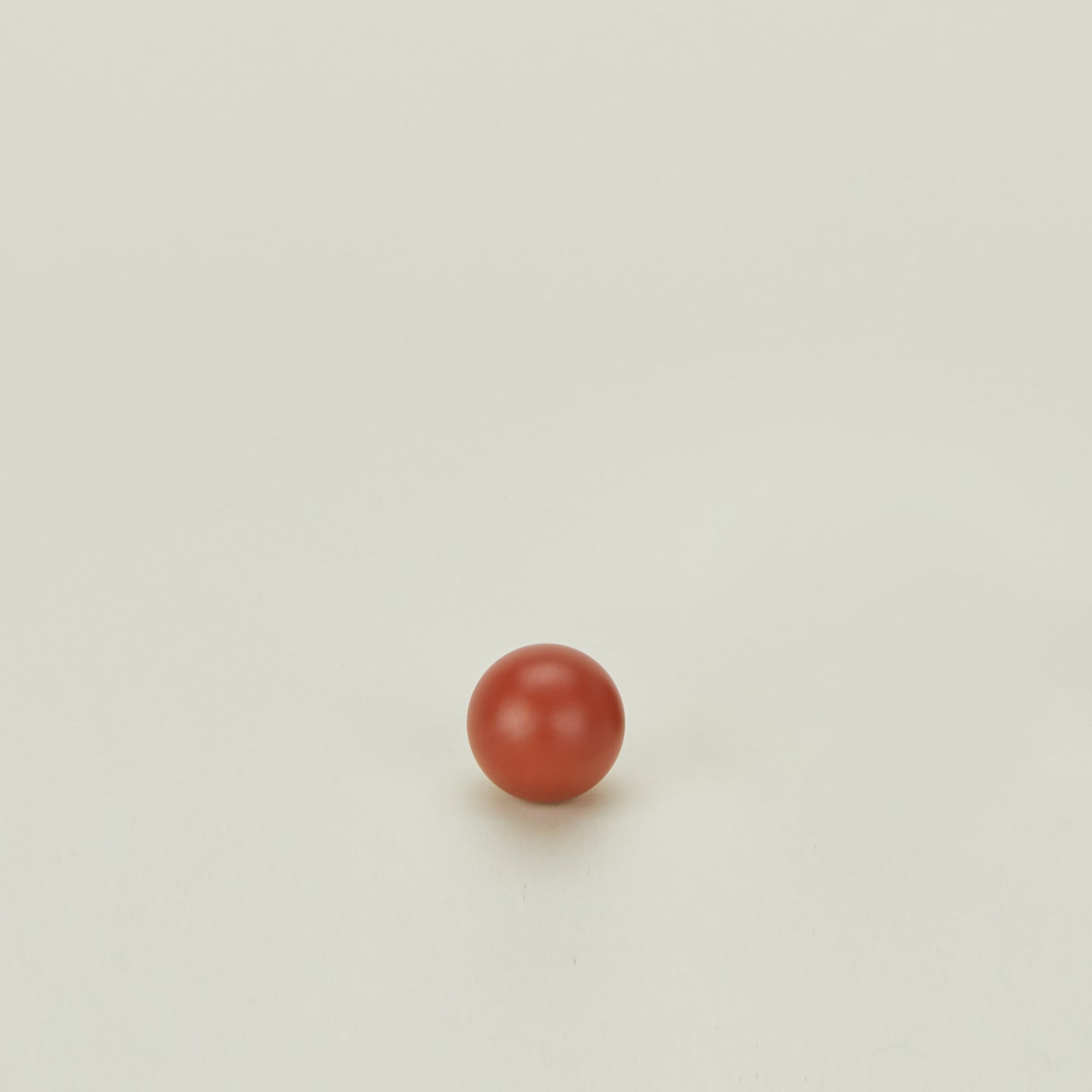 Small sphere knob in Terracotta.