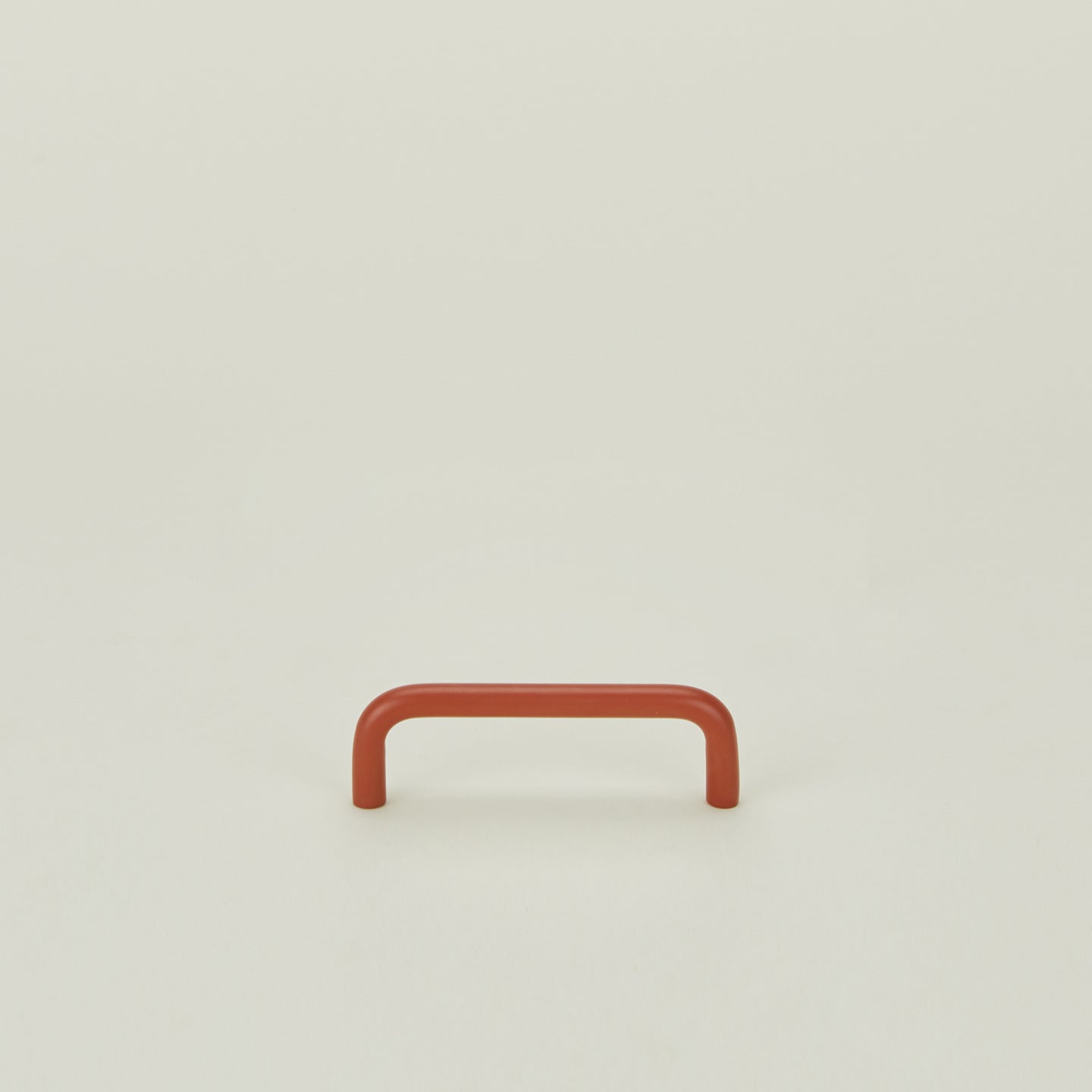 Small drawer pull in Terracotta.