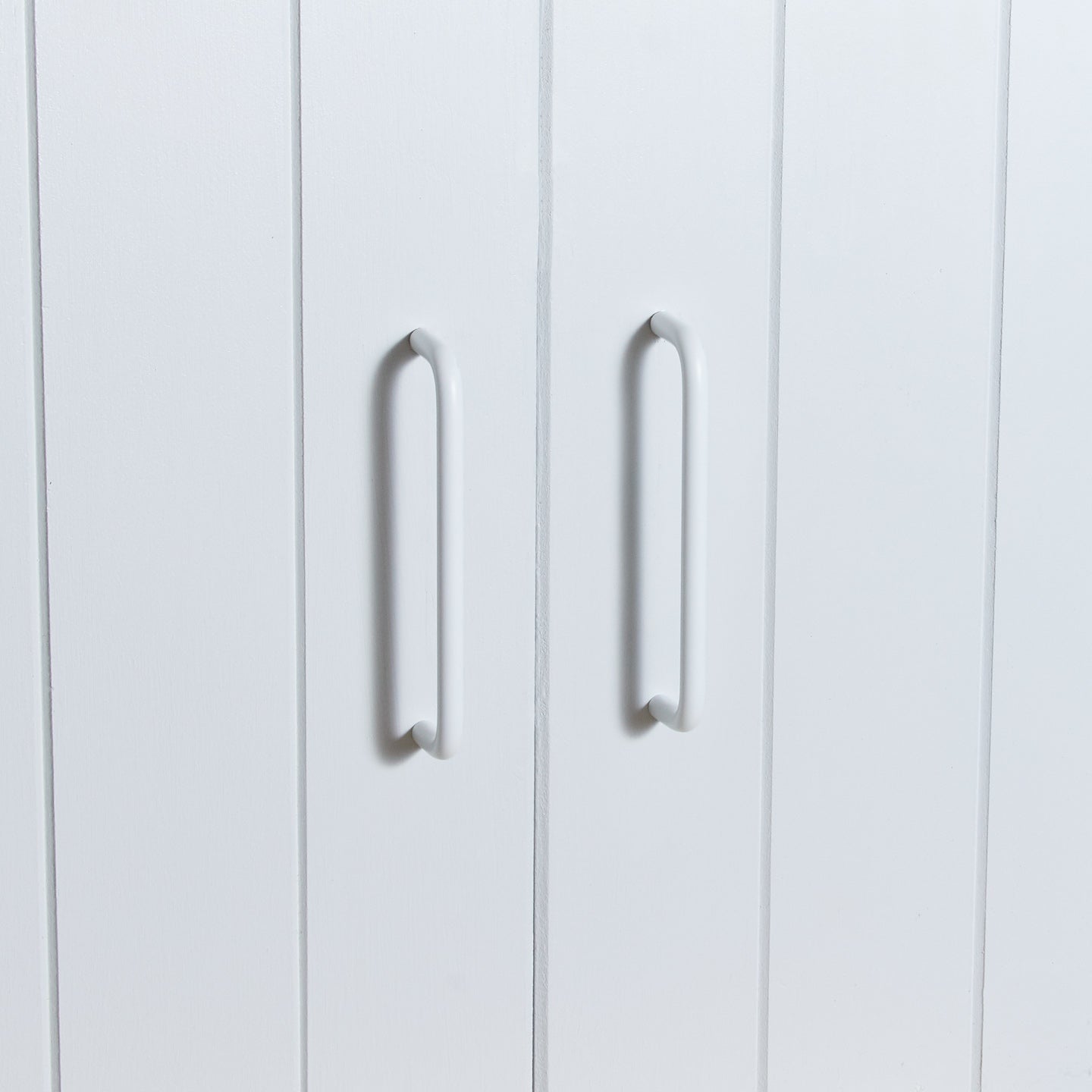 Large essential drawer pull in white on cabinet