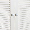 Small essential knobs in white on cabinet doors