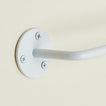 Close up view of essential toilet paper holder in white.