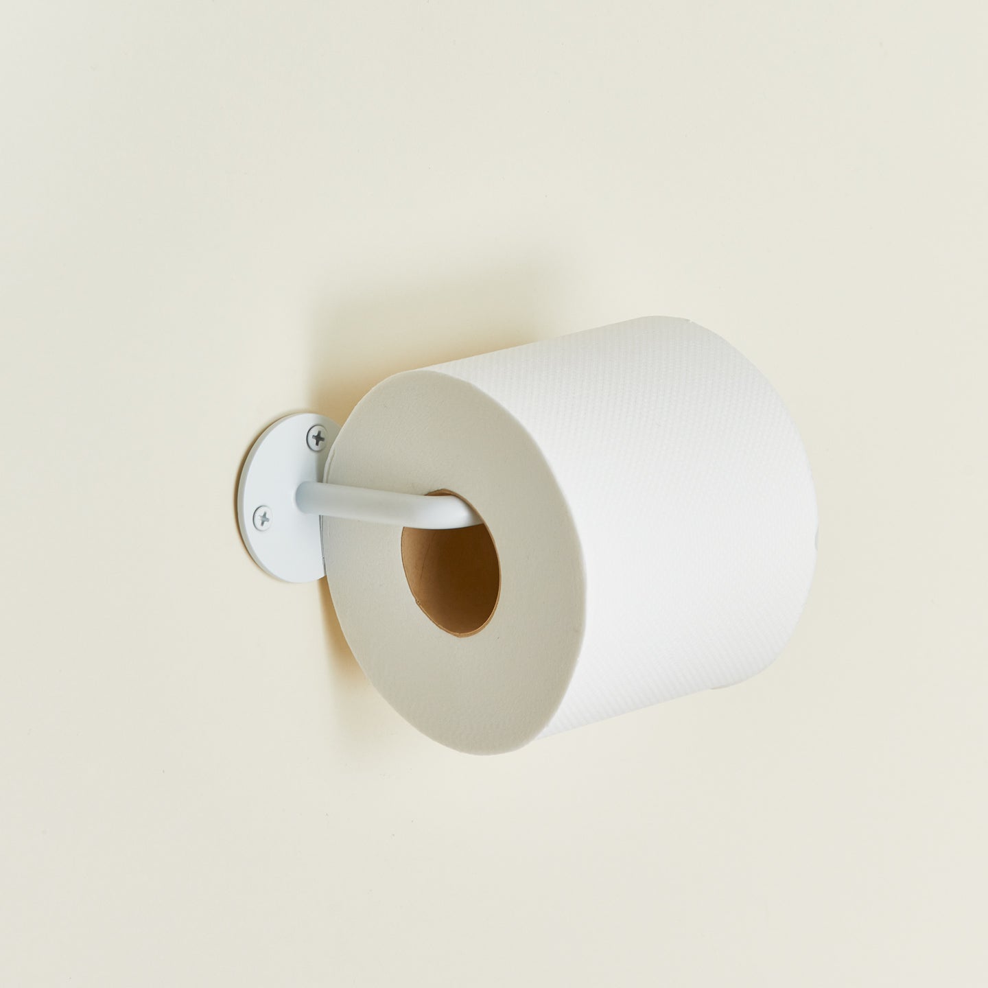 Essential toilet paper in white with toilet paper roll