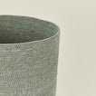 Close up view of essential woven wastebasket in sky