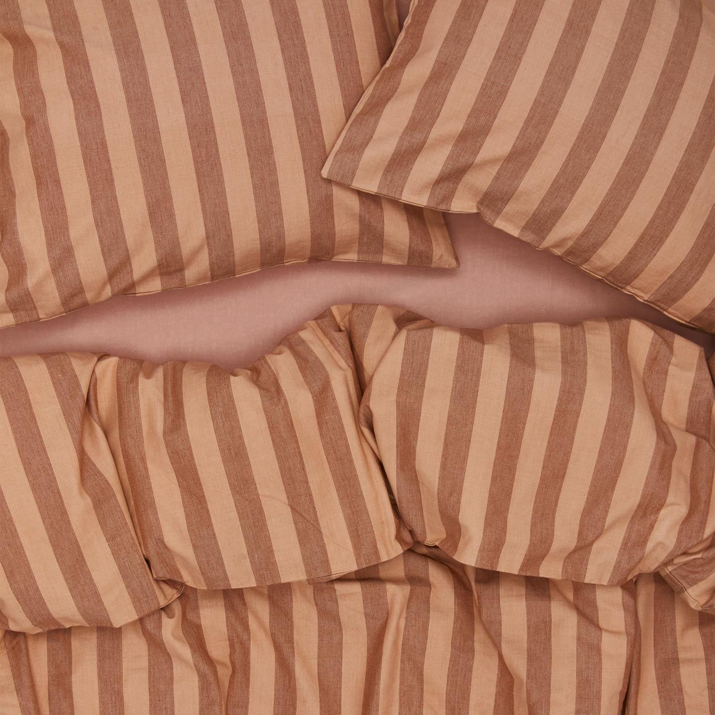 Essential Stripe Duvet - Blush/Terracotta on bed with matching pillow cases