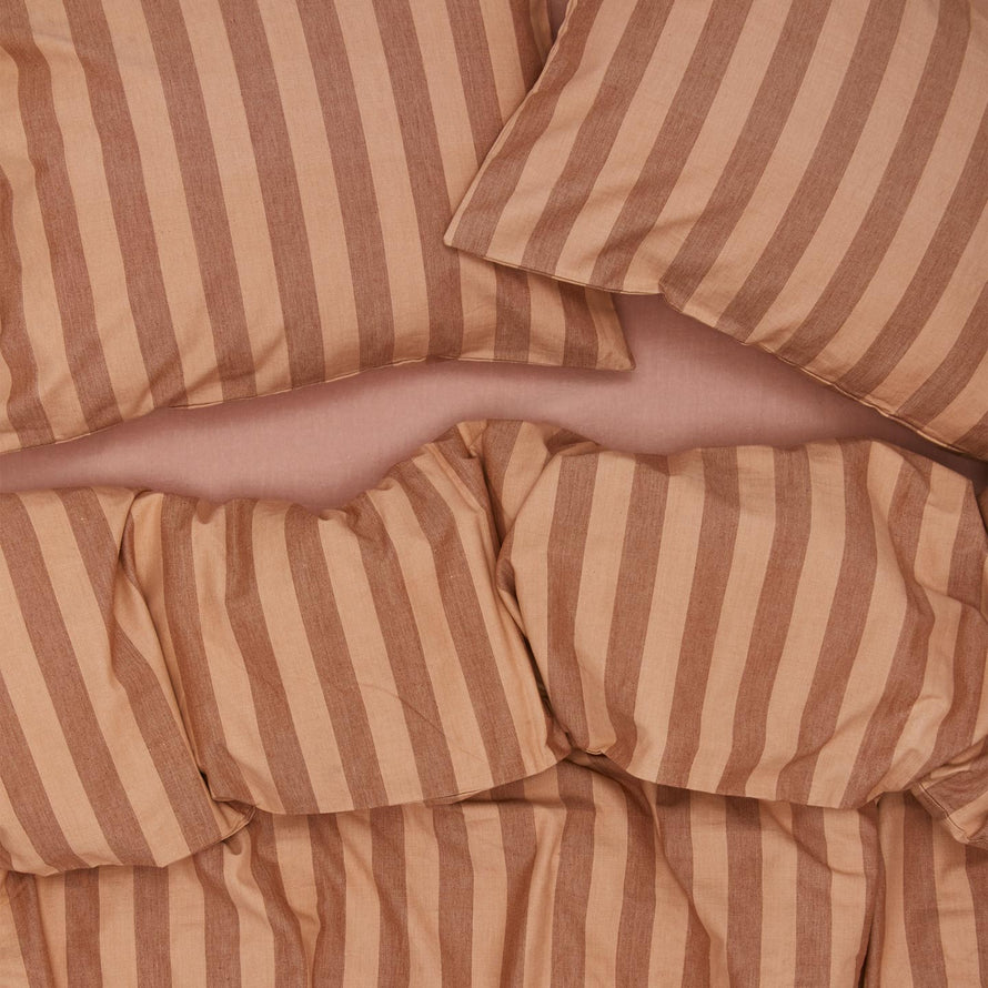 Essential Stripe Duvet - Blush/Terracotta on bed with matching pillow cases