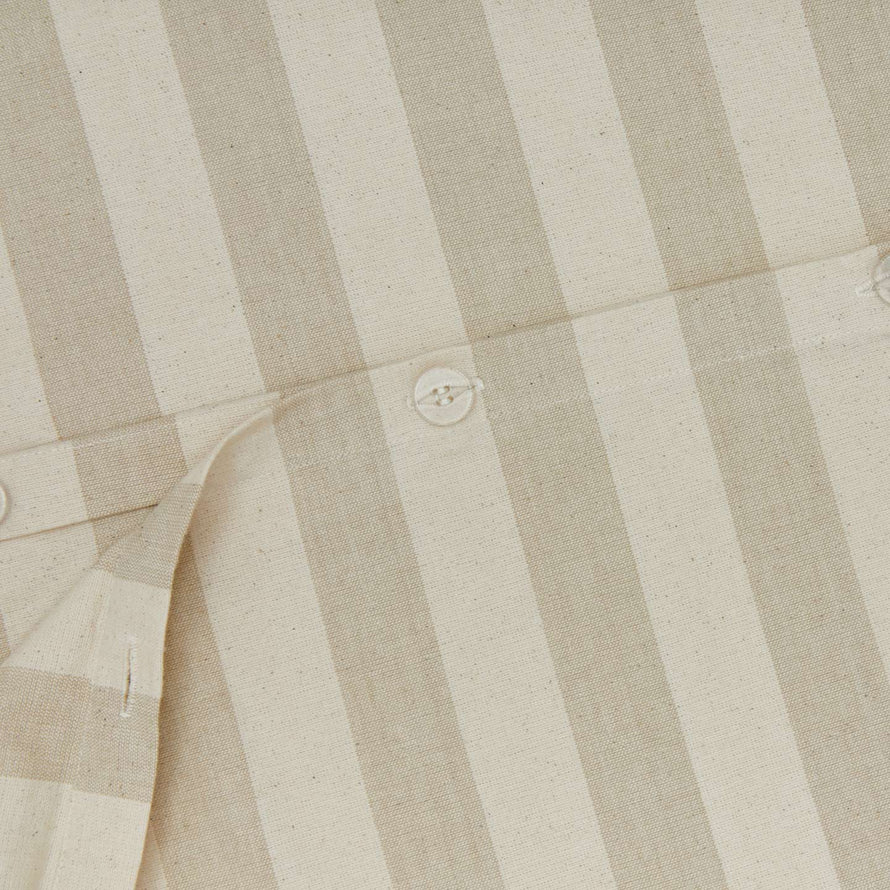 Close up view of essential striped duvet in ivory/flax