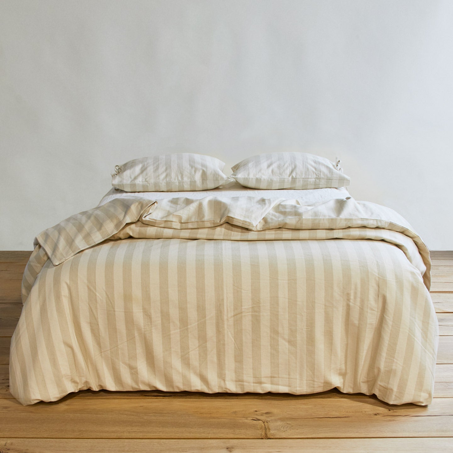 Essential Stripe Duvet - Ivory/Flax on bed with matching pillow cases
