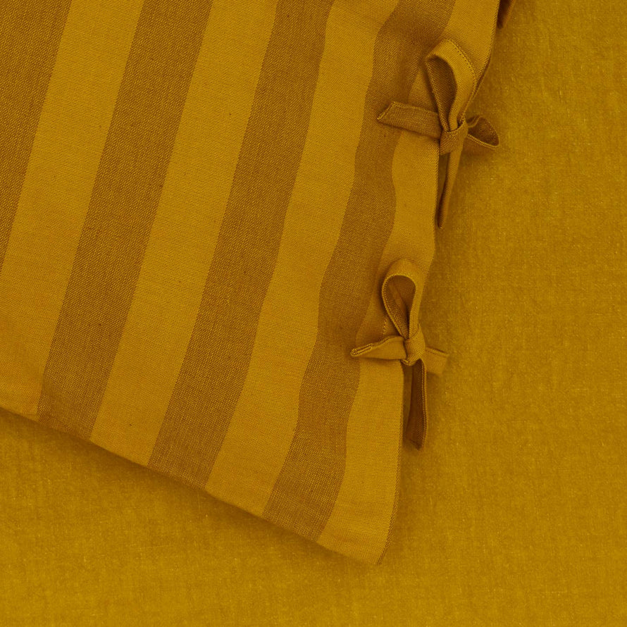 Close up view of mustard/bronze pillowcase