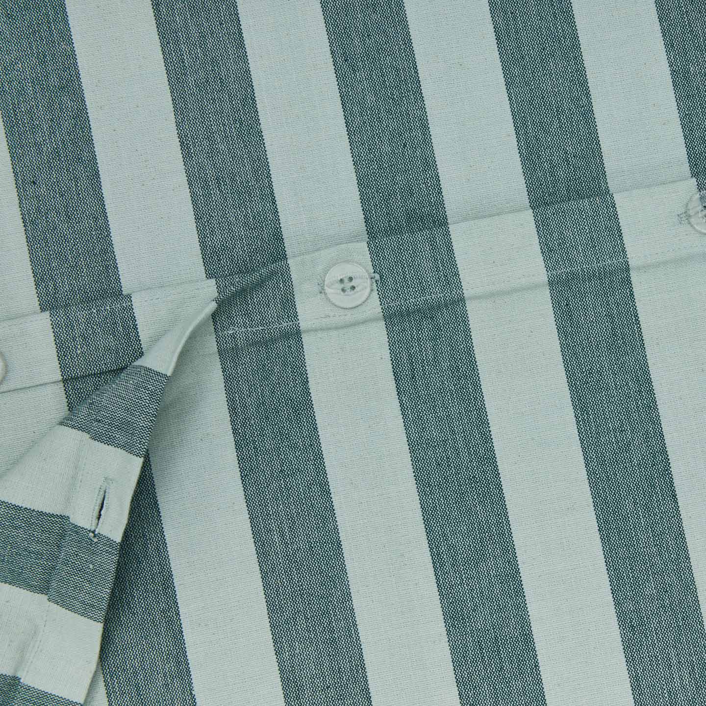 Close up view of essential striped duvet cover in sky/peacock