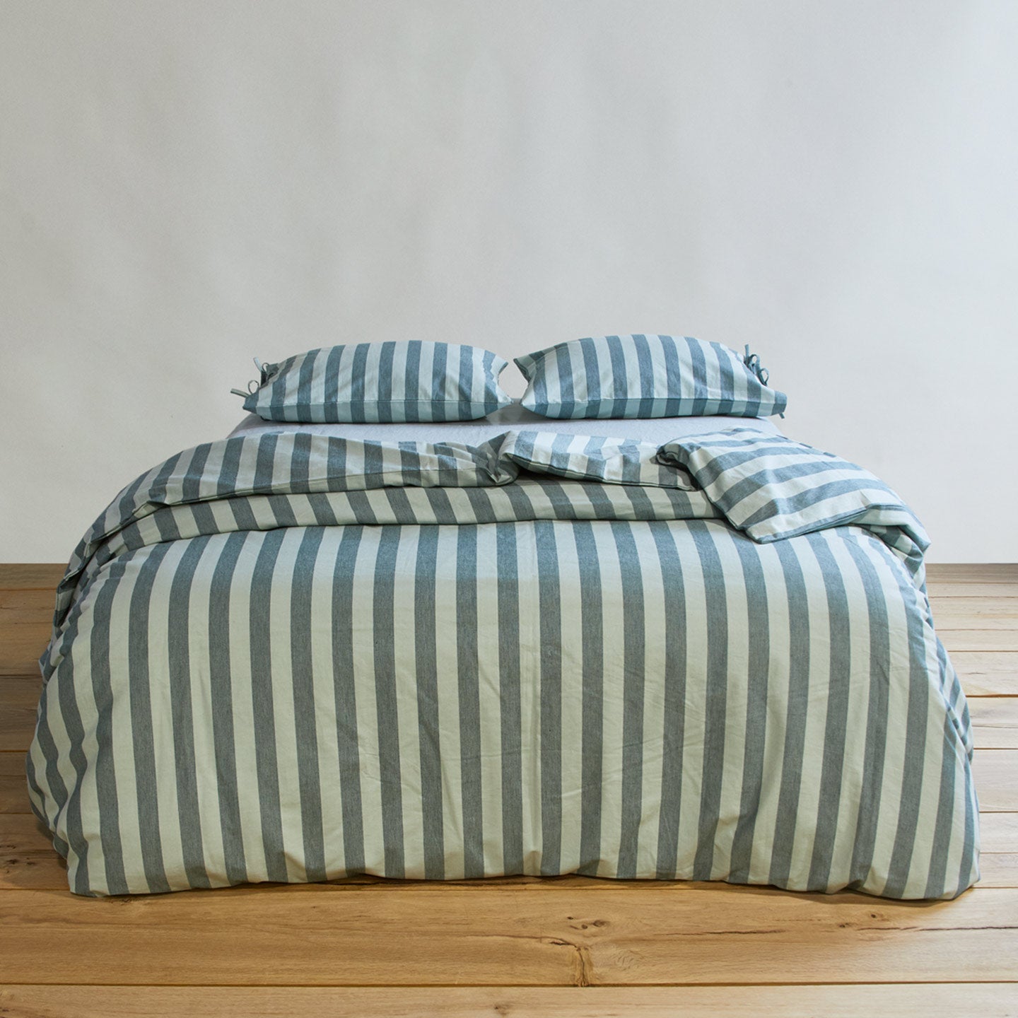Essential Stripe Duvet - Sky/Peacock on bed with matching pillow cases