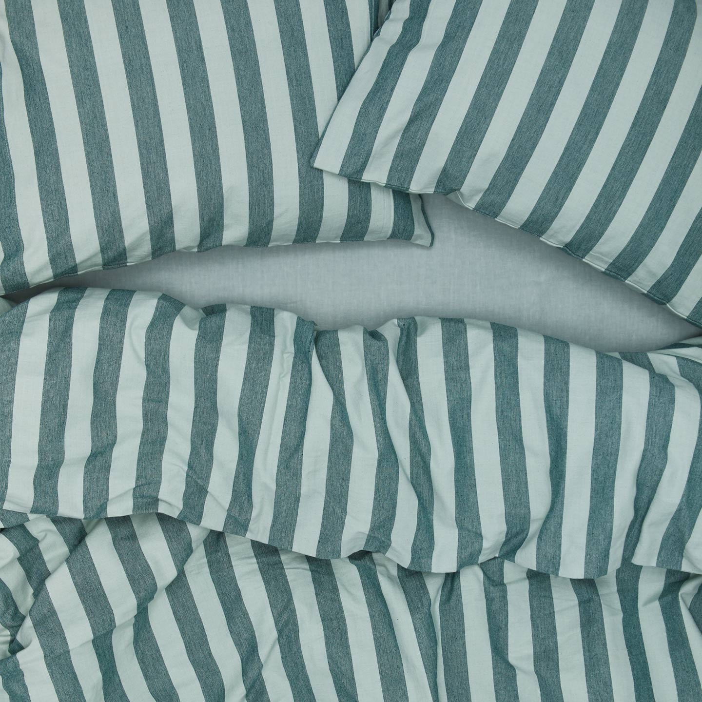 Essential Stripe Duvet - Sky/Peacock on bed with matching pillow cases