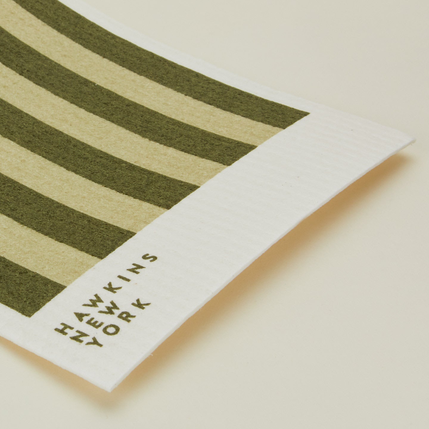 Close up view of essential swedish dishcloths in sage/olive