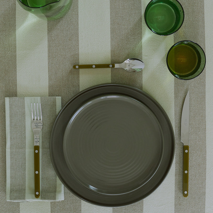 Placesetting on Essential Striped Tablecloth in Olive and Sage.
