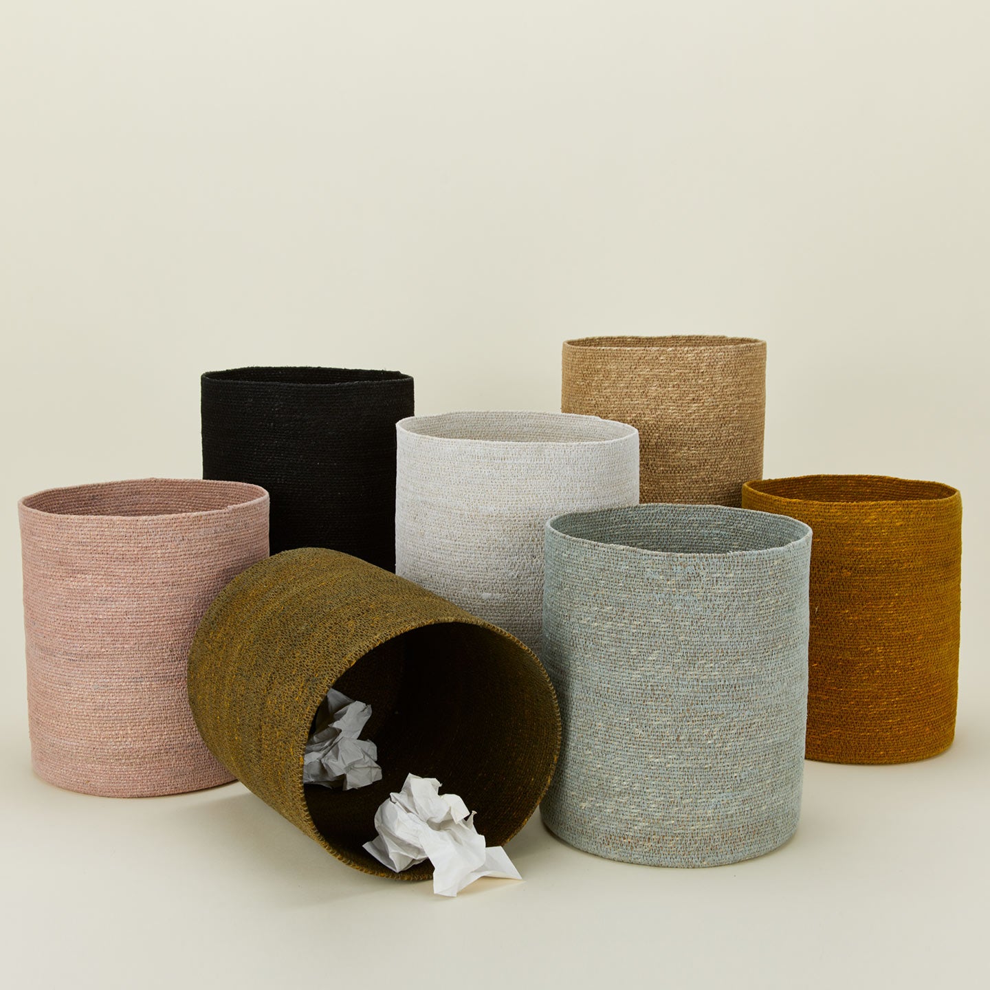 Essential woven wastebaskets in various colors