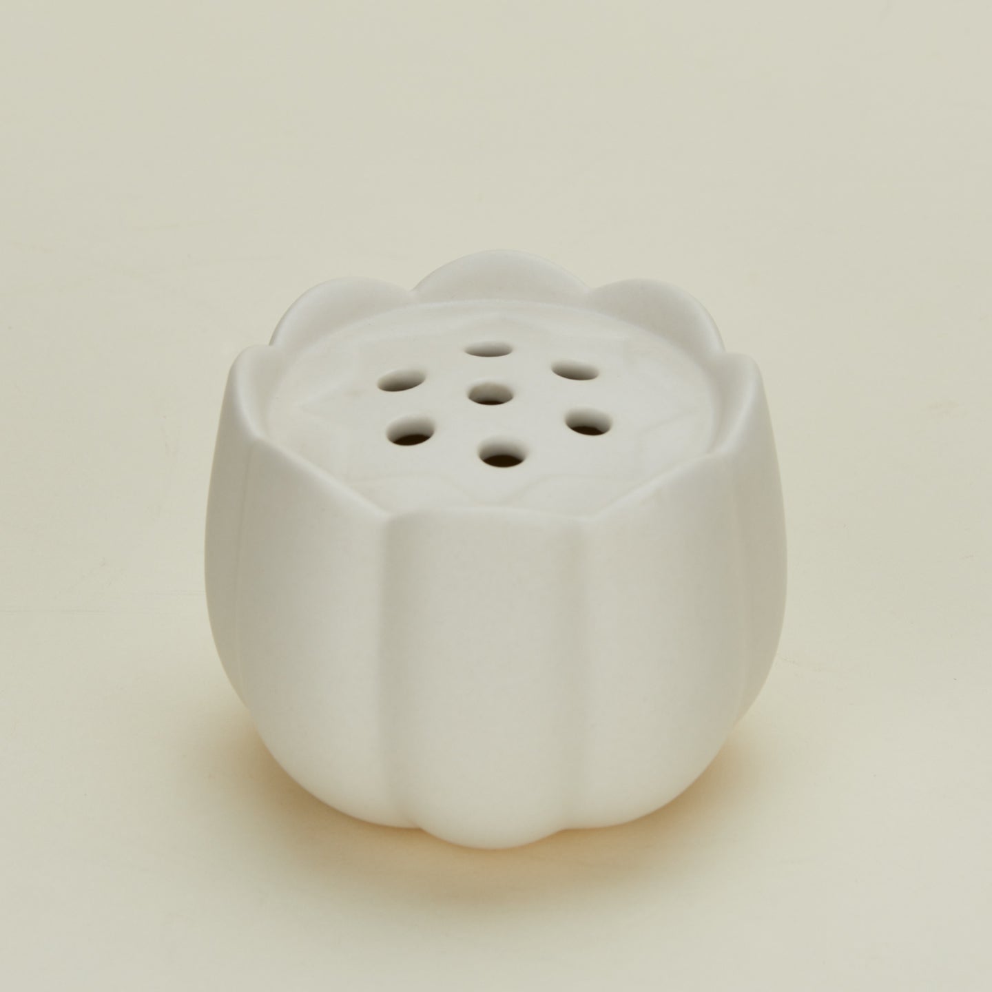 Detailed view of Floral society flower frog in small