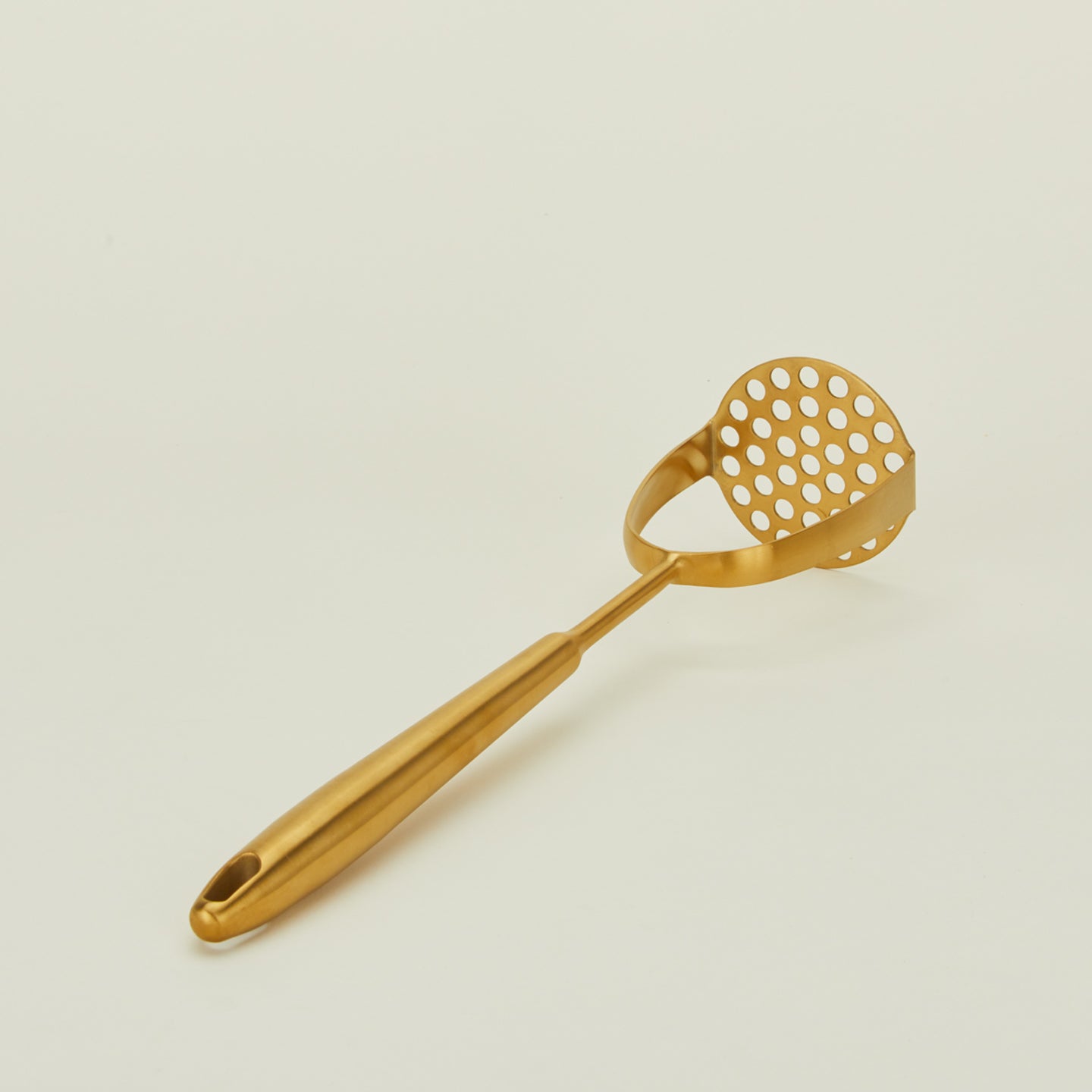 Detailed view of brass potato masher