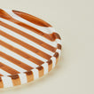 Close up view of Fodory brown striped dinner plate