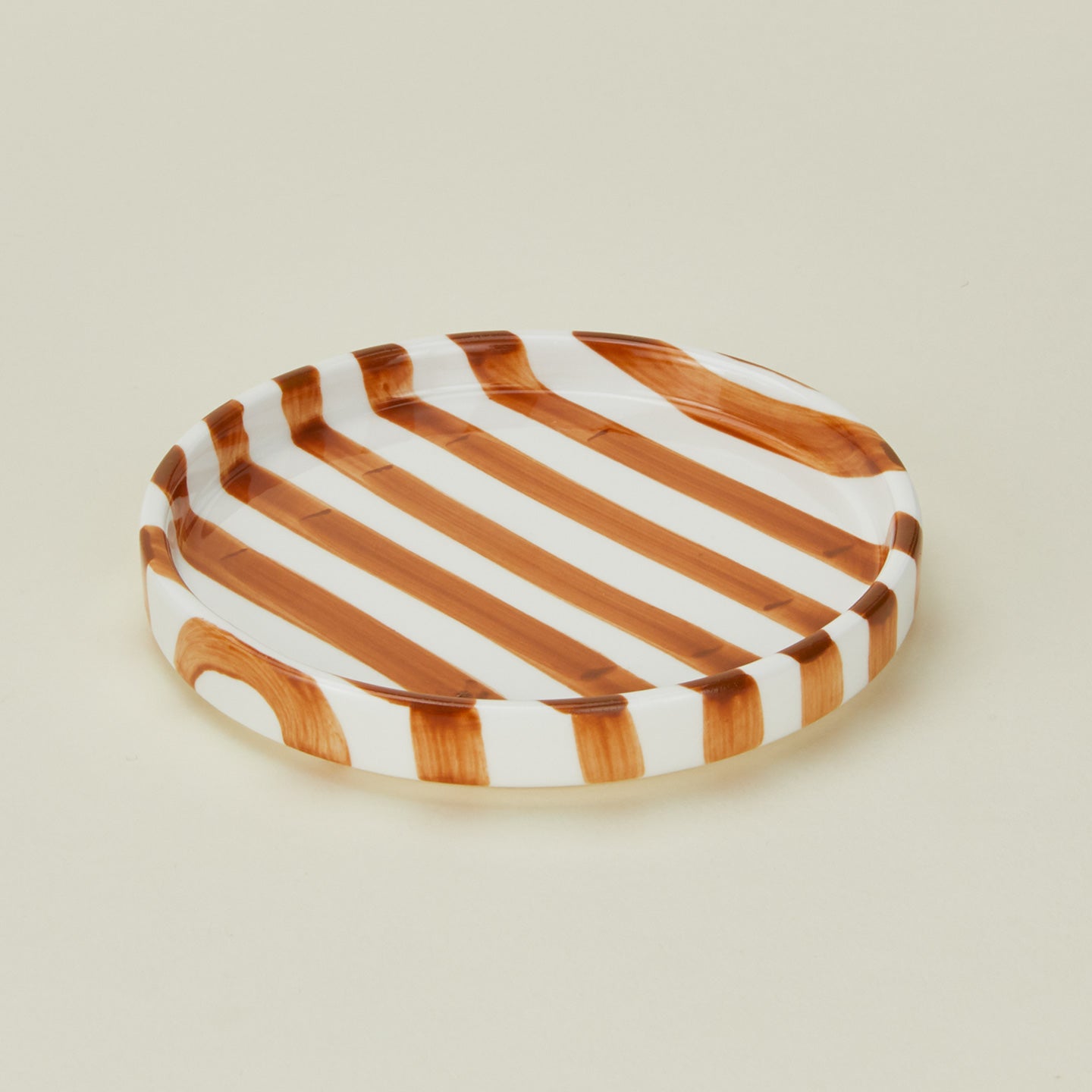 Detailed view of Fodory brown striped salad plate