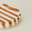 Close up view of Fodory brown striped salad plate