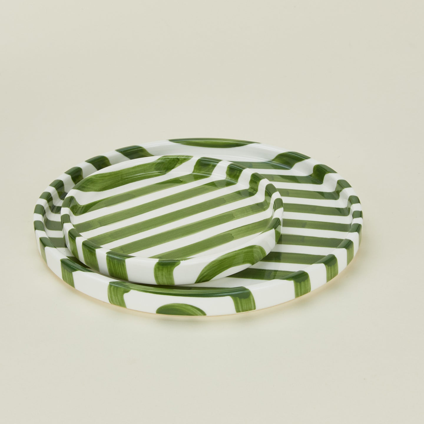 Close up view of Fodory olive striped plates