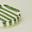 Close up view of Fodory olive striped salad plate