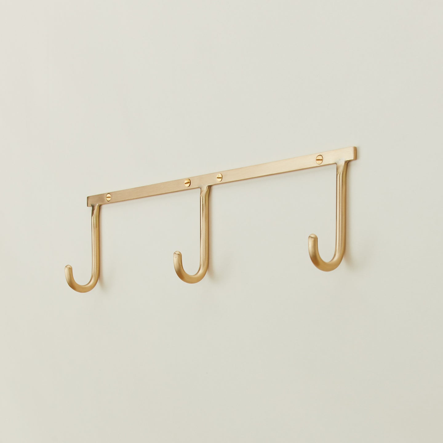 Brass hook rack trio