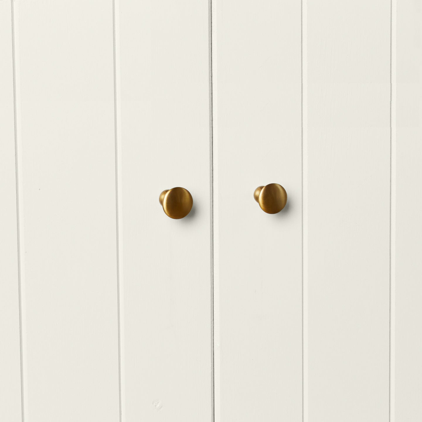 Large brass knobs on cabinet doors